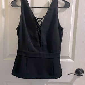 V cut with slight peplum.